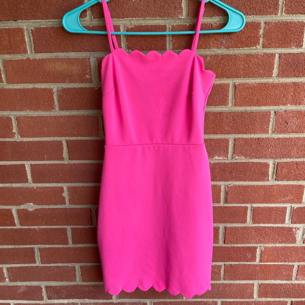 Hot pink dress by the city studio.